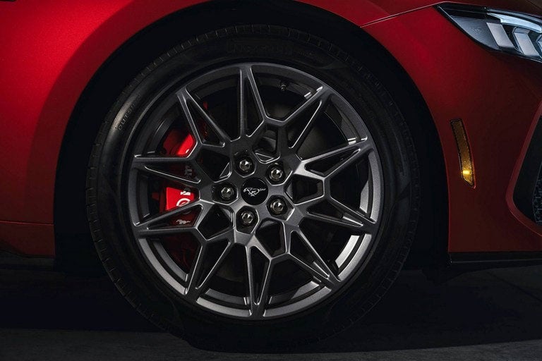 2024 Ford Mustang® model with a close-up of a wheel and brake caliper | Freedom Ford Greenville by Ed Morse in Greenville TX